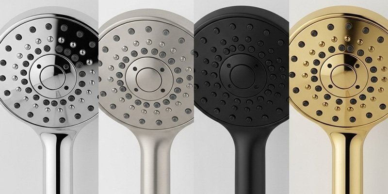 Close-up of various shower fixture finishes including polished chrome, brushed nickel, and matte black, showcasing different aesthetic options